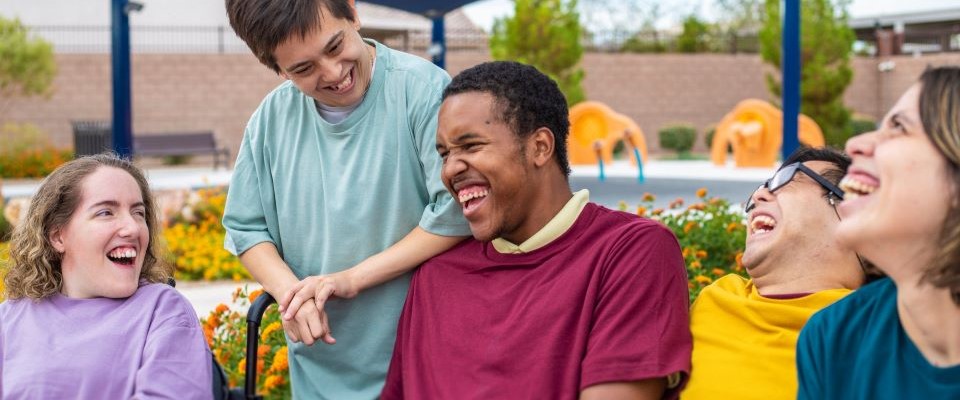 Group of folks with developmental disabilities laughing