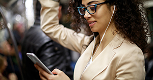 woman in subway wearing headphones