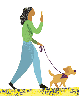 woman walks dog