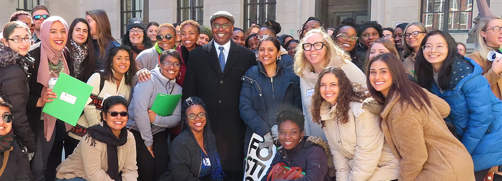 young adults in a group in front of government building
