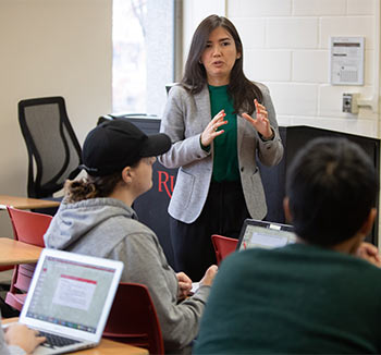 professor lectures to students in classroom