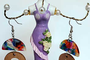 earrings hang off a human-shaped holder