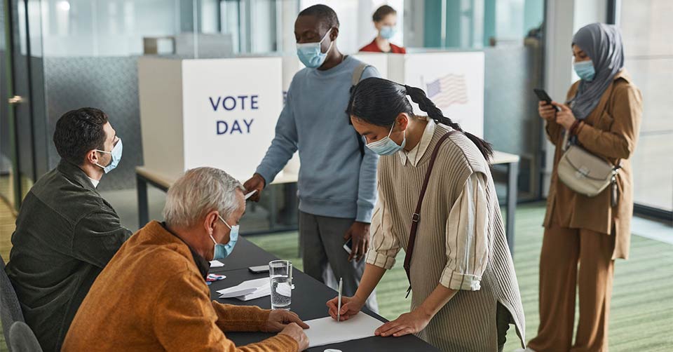 people at a poll place, peacefully waiting to vote