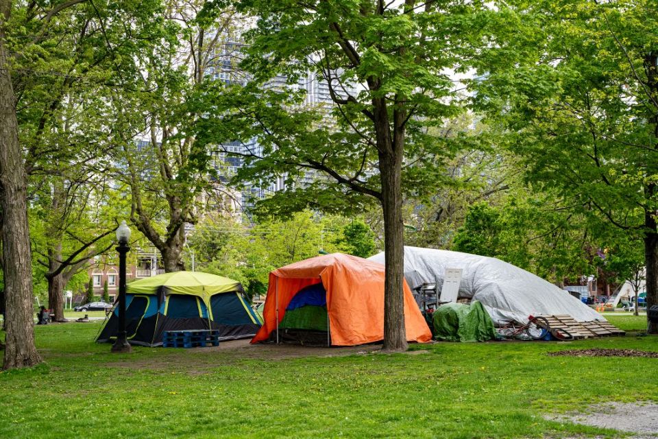 tents in an encampment of the unhoused