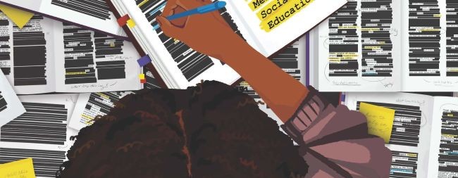 Person writing in notebooks with most of the content censored