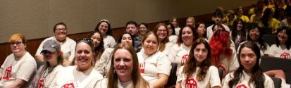 Social workers sitting in auditorium