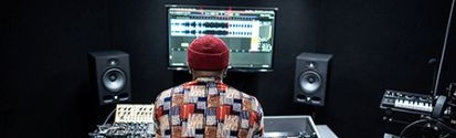 Man behind a music production table