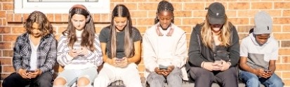 adolescents looking at phones