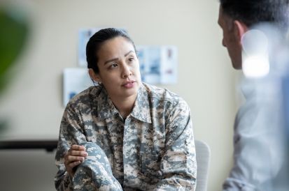 person in military uniform in therapy session
