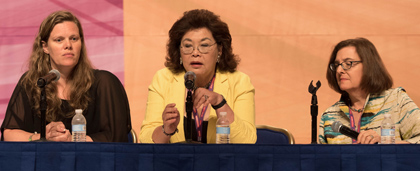 three women panelists on stage