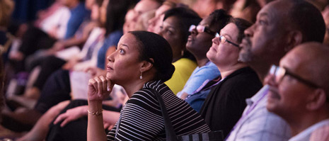 conference attendee looks intently forward