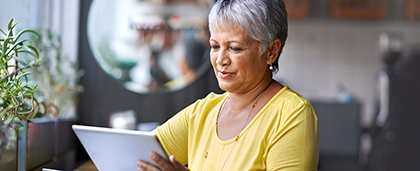 woman reads on a tablet