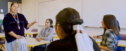 teacher in a classroom with teens