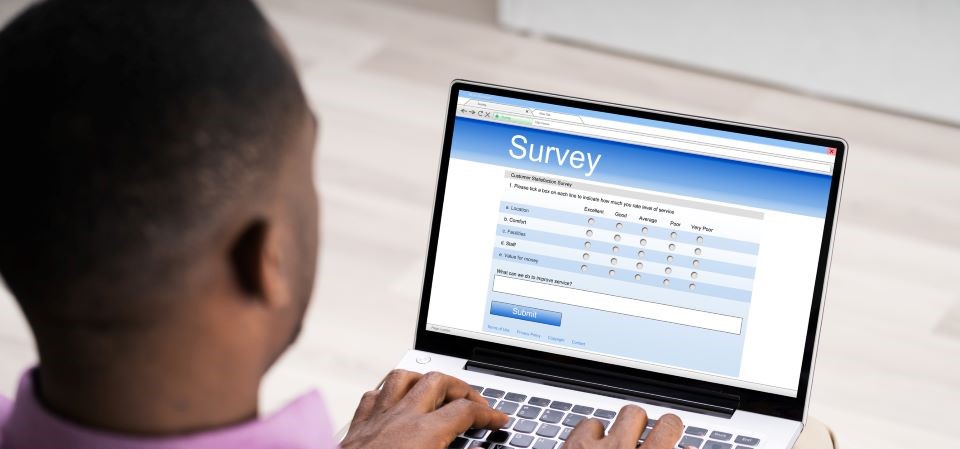 black man at laptop taking a survey