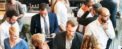 group of professionals mingle at a networking event