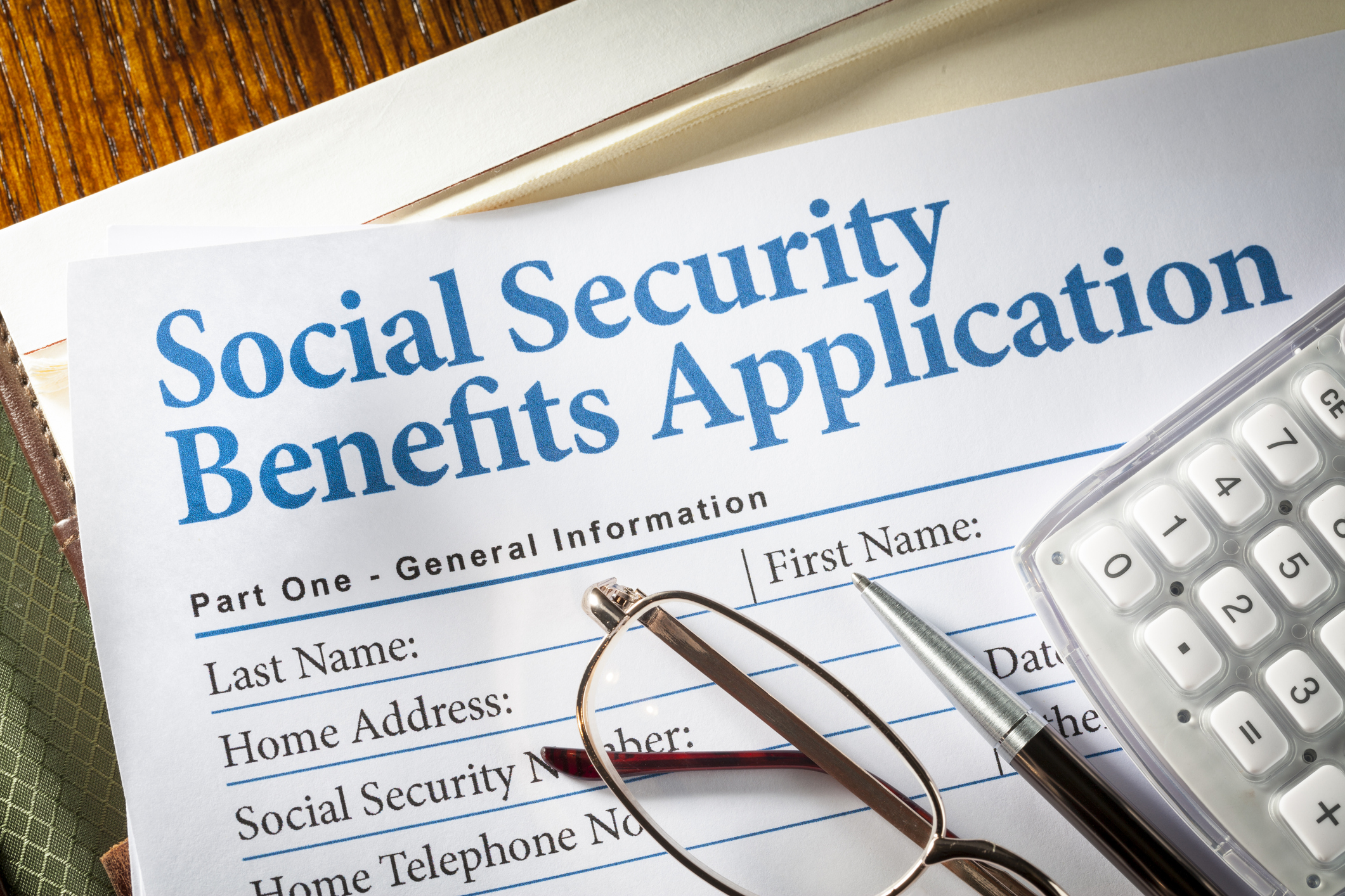 picture with paper that says social security benefits application