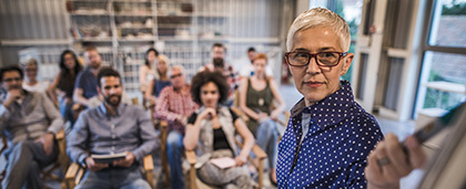 instructor in a classroom of adult learners