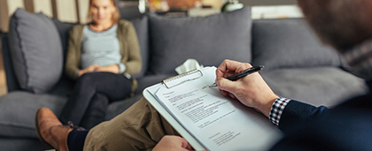 taking notes during a therapy session