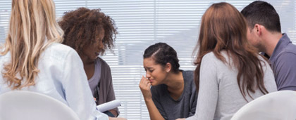 woman crying in a group counseling session