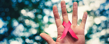 hand with pink ribbon