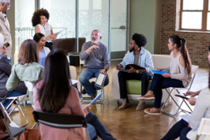 people sitting on chairs in a circle