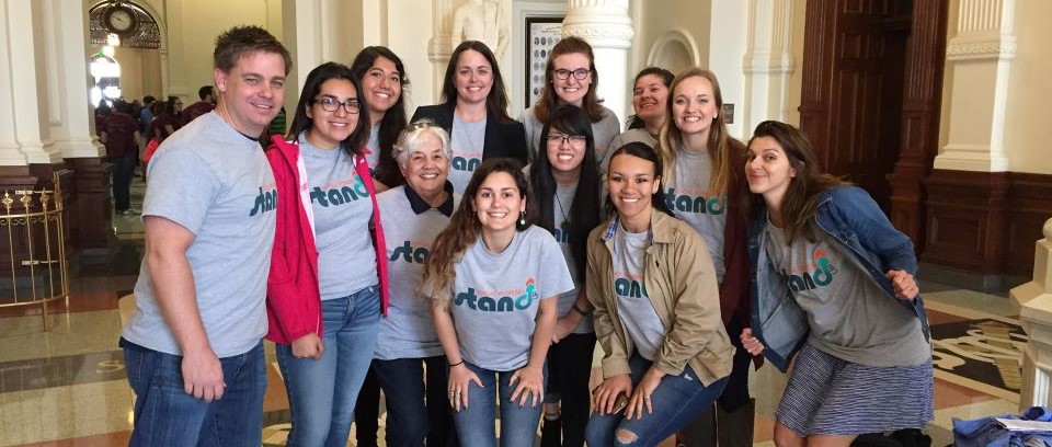 group standing in the capitol with NASW stand up shirts