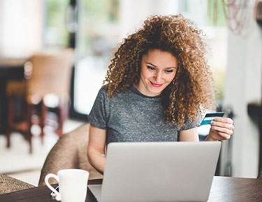 woman with laptop and credit card