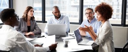 group around table having meeting